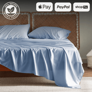 Single sheet and duvet set on a bed, featuring organic materials, with Apple Pay, PayPal, and Shop Pay logos.