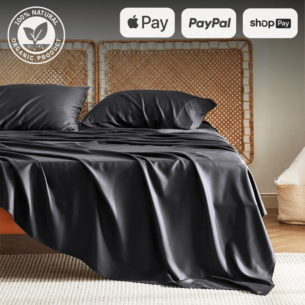 Luxurious black sheet and duvet set with organic certification on a stylish rattan bed, available for purchase with Apple Pay, PayPal, and Shop Pay.