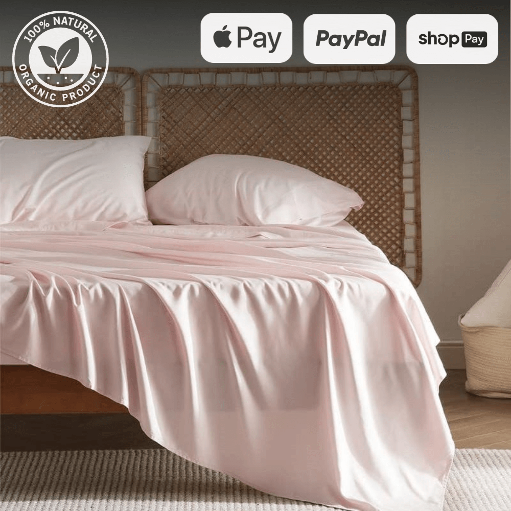 Single size pink sheet and duvet set on a bed with wicker headboard, featuring organic product badge and various payment options.