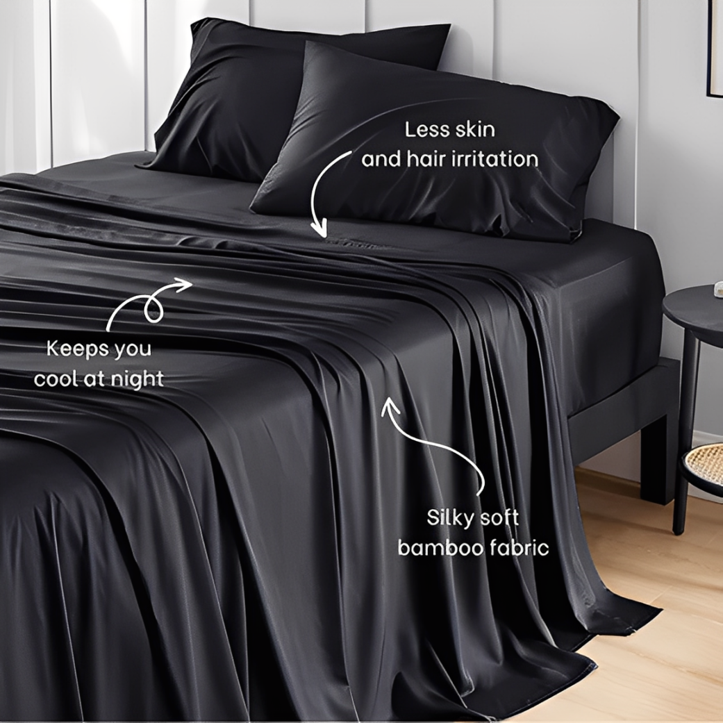 Black bamboo sheets neatly draped over a bed, showing the smooth and cooling texture of 100% bamboo bedding.