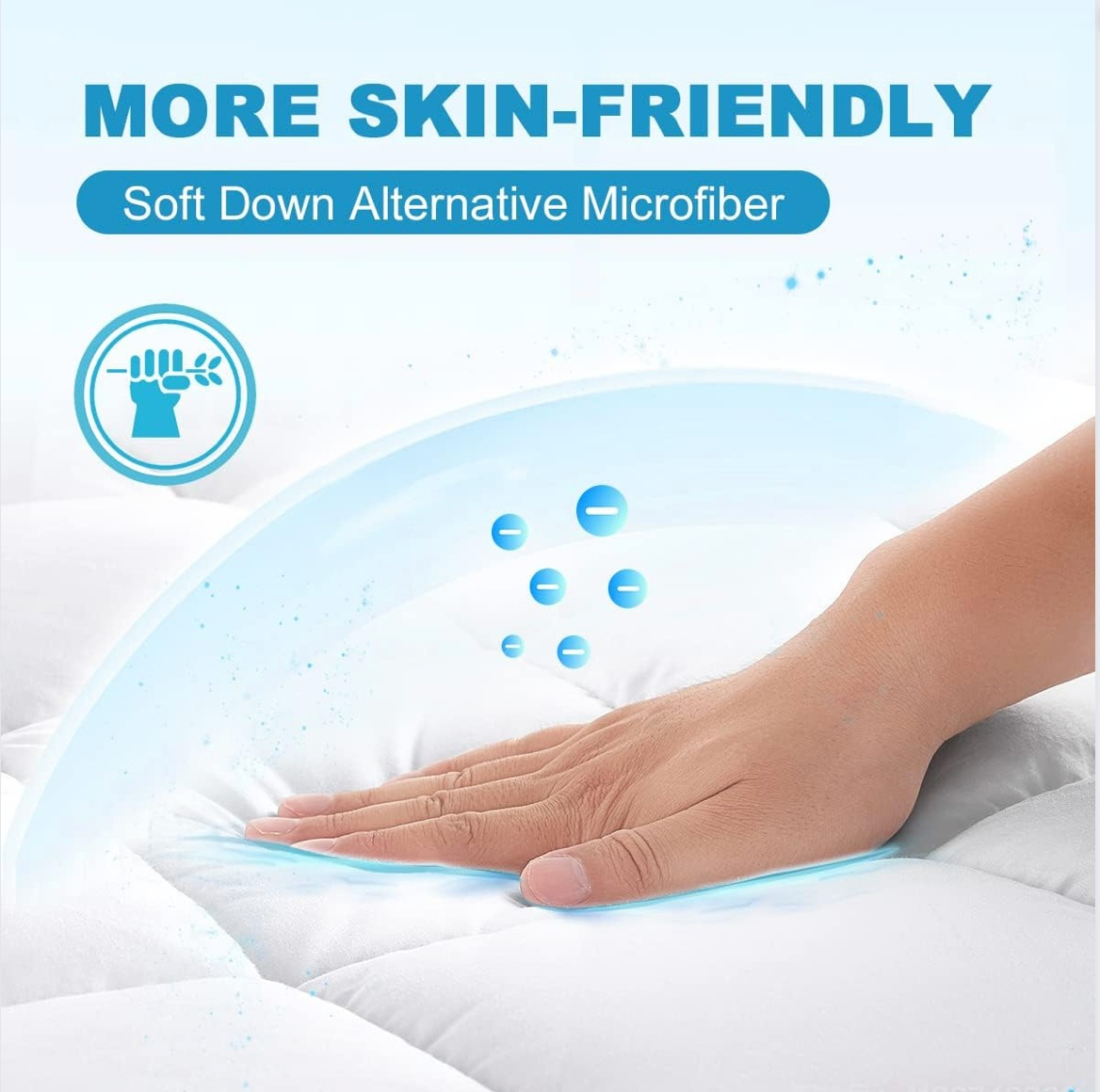 Hand pressing down on a white bamboo mattress topper, showcasing its soft down alternative microfiber and skin-friendly properties.